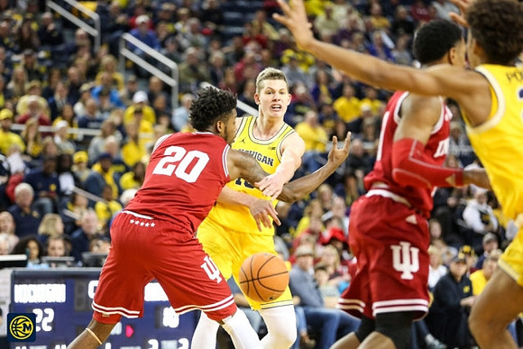 Moritz Wagner (13) and Jordan Poole (2)
