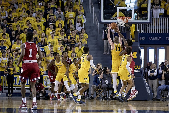 Charles Matthews (1), Zavier Simpson (3), Moritz Wagner (13), and Jordan Poole (2)