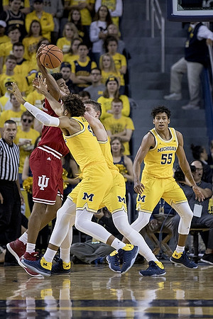 Isaiah Livers (4), Moritz Wagner (13), and Eli Brooks (55)