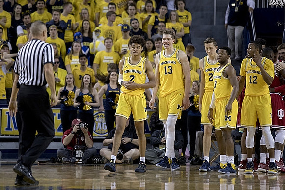 Jordan Poole (2), Moritz Wagner (13), Duncan Robinson (22), Zavier Simpson (3), and Muhammad-Ali Abdur-Rahkman (12)