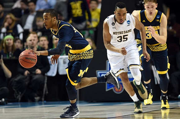 Muhammad-Ali Abdur-Rahkman (12) and Mark Donnal (34)