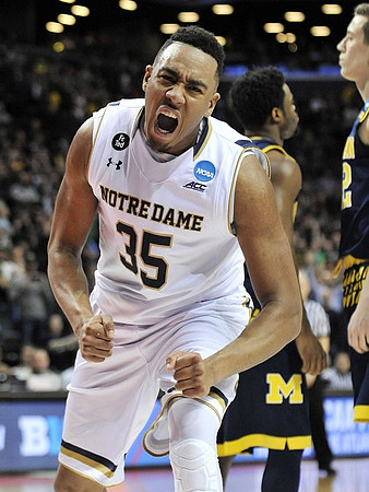 Derrick Walton Jr. (10) and Duncan Robinson (22)