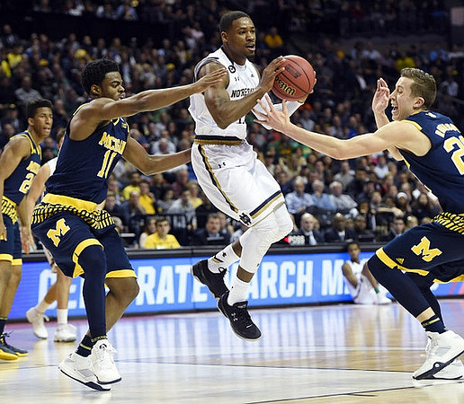 Aubrey Dawkins (24), Derrick Walton Jr. (10), and Duncan Robinson (22)