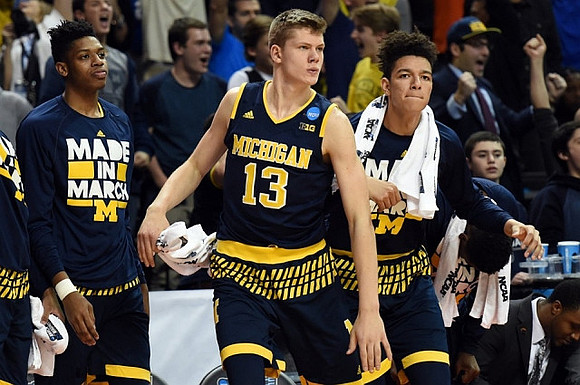 Kameron Chatman (3), Moritz Wagner (13), and D.J. Wilson (5)