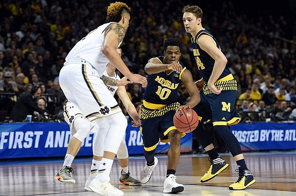 Derrick Walton Jr. (10) and Mark Donnal (34)
