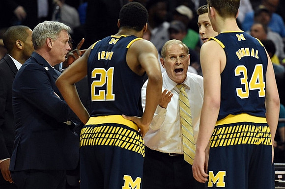 Jeff Meyer, Zak Irvin (21), John Beilein, Duncan Robinson (22), and Mark Donnal (34)