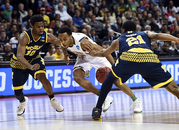 Derrick Walton Jr. (10) and Zak Irvin (21)