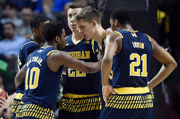 Muhammad-Ali Abdur-Rahkman (12), Derrick Walton Jr. (10), Duncan Robinson (22), Moritz Wagner (13), and Zak Irvin (21)