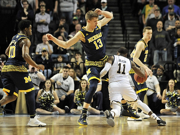 Derrick Walton Jr. (10), Moritz Wagner (13), and Duncan Robinson (22)