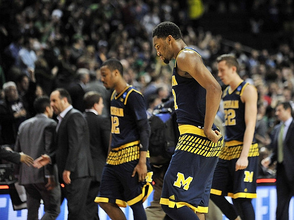 Notre Dame Head Coach Mike Brey, Muhammad-Ali Abdur-Rahkman (12), Zak Irvin (21), and Duncan Robinson (22)