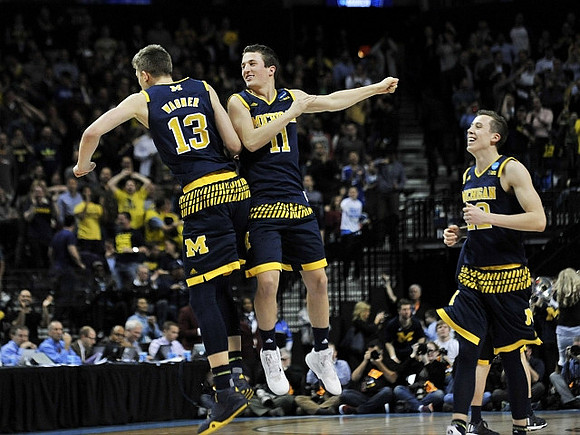 Moritz Wagner (13), Andrew Dakich (11), and Duncan Robinson (22)