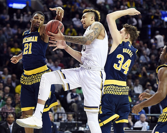 Zak Irvin (21) and Mark Donnal (34)