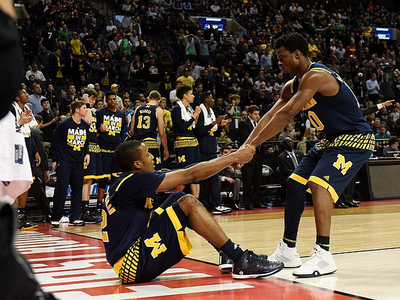 Muhammad-Ali Abdur-Rahkman (12) and Derrick Walton Jr. (10)