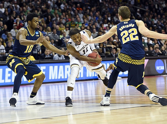 Derrick Walton Jr. (10) and Duncan Robinson (22)