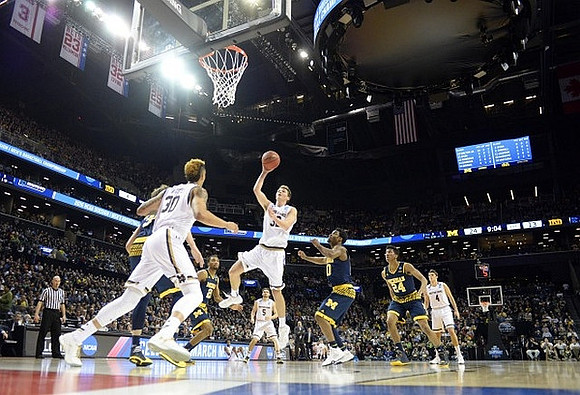Mark Donnal (34), Zak Irvin (21), Derrick Walton Jr. (10), and Aubrey Dawkins (24)