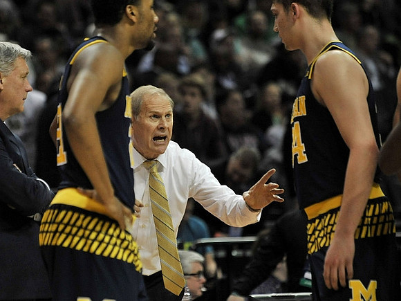 Jeff Meyer, Zak Irvin (21), John Beilein, and Mark Donnal (34)
