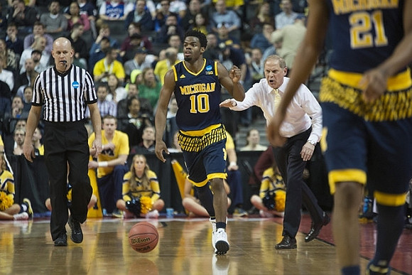 Derrick Walton Jr. (10) and Zak Irvin (21)