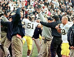 Eric Brackins (51), Rob Renes (58), and Coaches