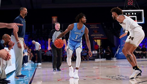 Saddi Washington, Juwan Howard, and Isaiah Livers (2)