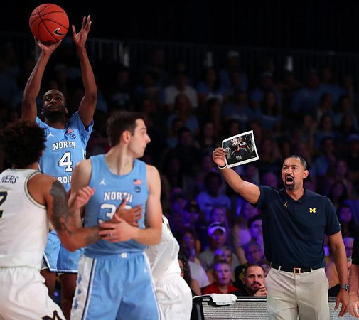 Isaiah Livers (2) and Juwan Howard