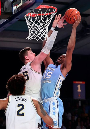 Isaiah Livers (2) and Jon Teske (15)