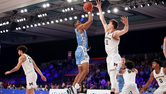 Brandon Johns Jr. (23), Colin Castleton (11), Eli Brooks (55), and David DeJulius (0)
