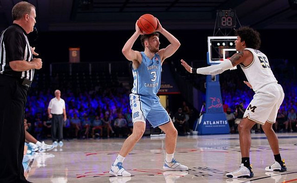 North Carolina Head Coach Roy Williams and Eli Brooks (55)
