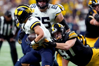 Zak Zinter (65) and Blake Corum (2)