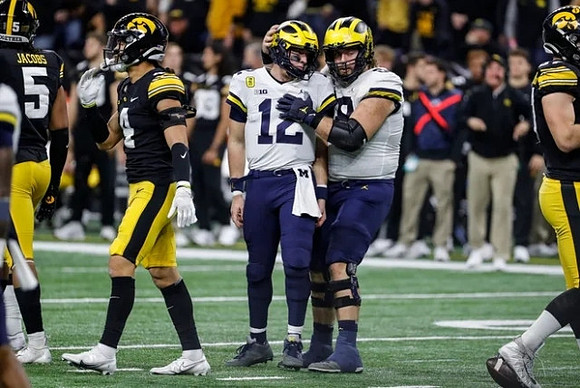 Cade McNamara (12) and Andrew Vastardis (68)