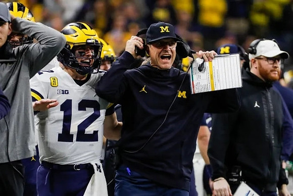 Cade McNamara (12), Jim Harbaugh, and Jay Harbaugh