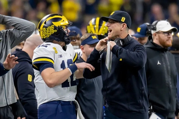 Cade McNamara (12), Jim Harbaugh, and Jay Harbaugh