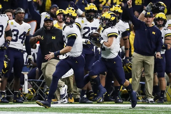 J.J. McCarthy (9) and Blake Corum (2)
