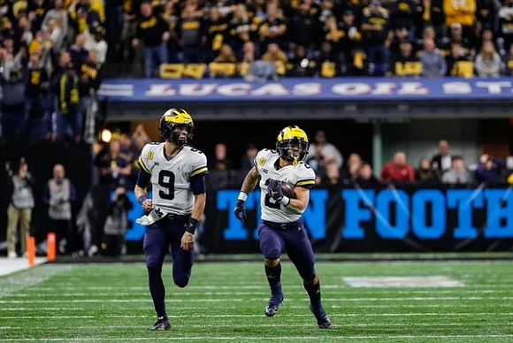 J.J. McCarthy (9) and Blake Corum (2)