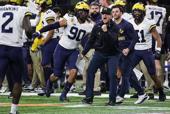 Brad Hawkins (2), Mike Morris (90), Jim Harbaugh, and Nikhai Hill-Green (41)