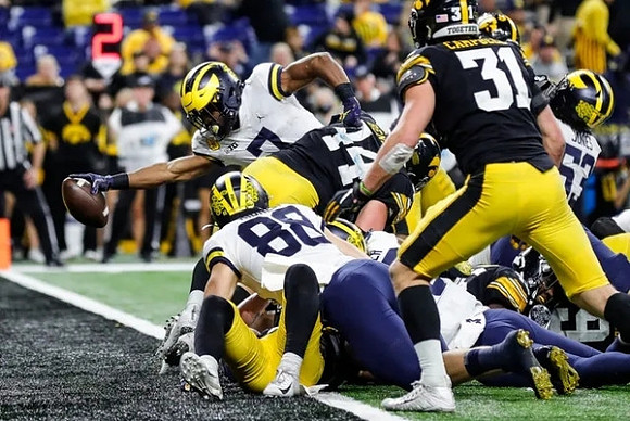 Donovan Edwards (7), Matthew Hibner (88), and Trente Jones (53)