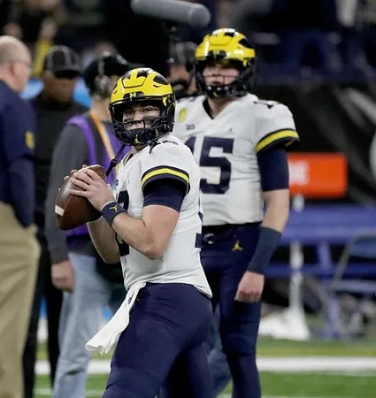 Cade McNamara (12) and Alan Bowman (15)