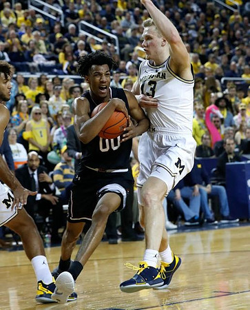 Isaiah Livers (4) and Ignas Brazdeikis (13)