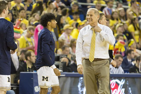 Eli Brooks (55) and John Beilein