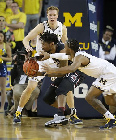 Ignas Brazdeikis (13) and Zavier Simpson (3)