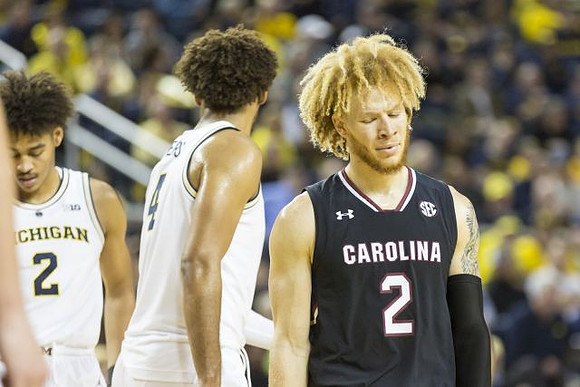 Jordan Poole (2) and Isaiah Livers (4)