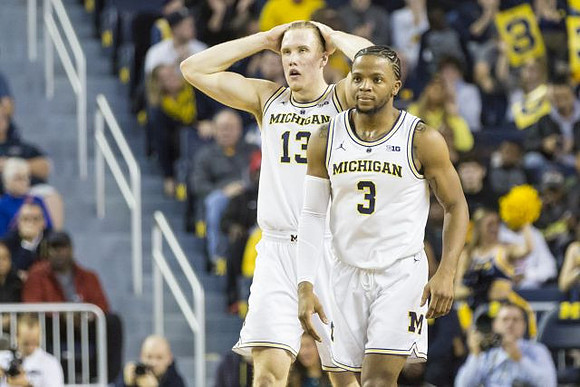 Ignas Brazdeikis (13) and Zavier Simpson (3)