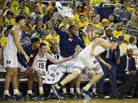 Austin Davis (51) and Michigan Team