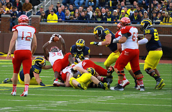 Joe Bolden (35), Jourdan Lewis (26), Matthew Godin (99), and Ondre Pipkins (56)
