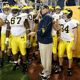 Terrance Taylor (67), Rich Rodriguez, and Jason Gingell (34)