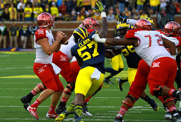 Frank Clark (57) and Ondre Pipkins (56)