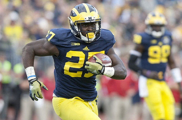 Derrick Green (27) and Devin Gardner (98)