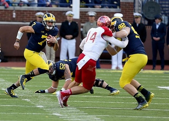 Shane Morris (7), Mason Cole (52), and Keith Heitzman (92)