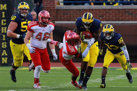Mason Cole (52), De'Veon Smith (4), and Dennis Norfleet (23)