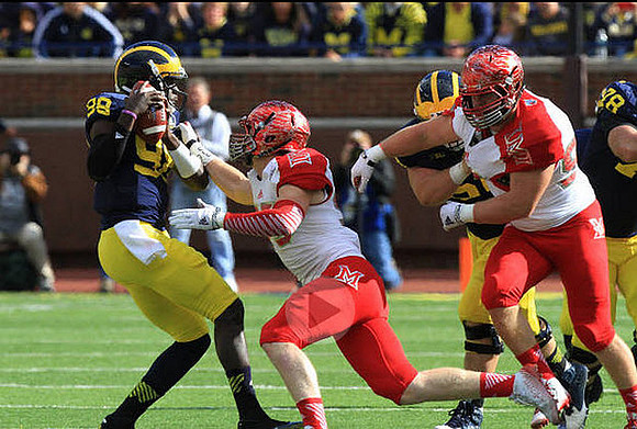 Devin Gardner (98) and Erik Magnuson (78)