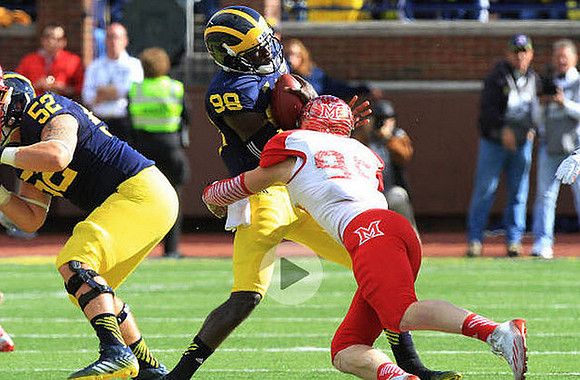 Mason Cole (52) and Devin Gardner (98)